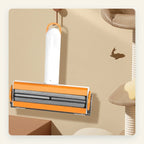 FurFlick pet hair remover hanging from its loop with the brush side facing out