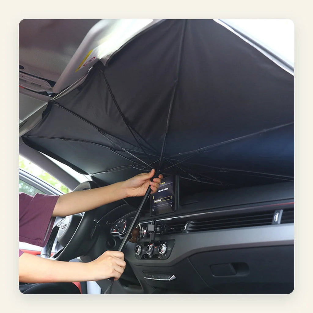 Opening the ShadeFlip umbrella sunshade by hand inside a car