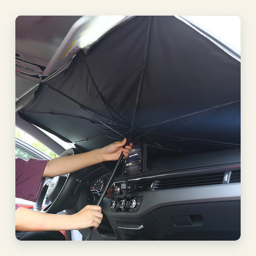 Opening the ShadeFlip umbrella sunshade by hand inside a car